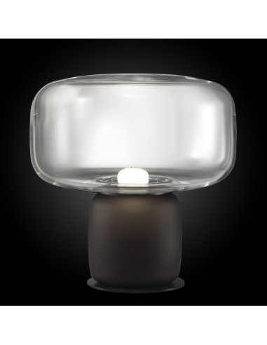 Cogi modern design table lamp in transparent murano glass on a black background Cogi modern design table lamp in transparent murano glass on a black background