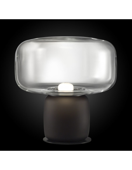 Cogi modern design table lamp in transparent murano glass on a black background Cogi modern design table lamp in transparent murano glass on a black background